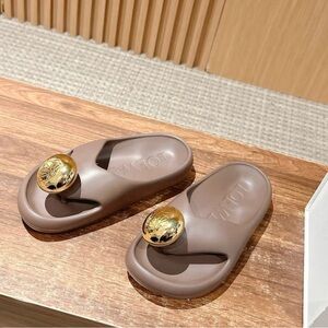 Loewe Taupe Slip-On Sandals with Gold Anagram Medallions